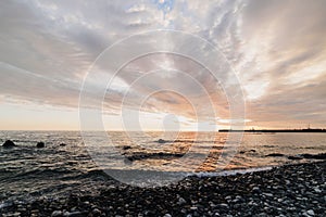 Beautiful sunset on the Black sea. rocks on the sea surf.