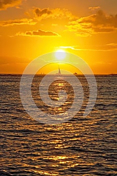 Beautiful sunset with boat on ocean on Hawaii