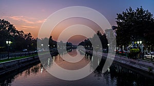 Beautiful sunset Bucharest Romania Bucuresti Dambovita river landscape reflection