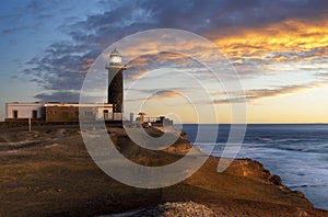 Beautiful sunset on the cliffs of Faro de Jandia