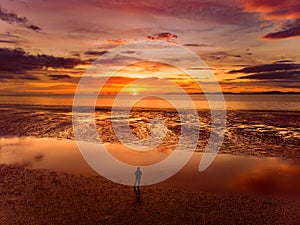 Beautiful sunset colors over the coastline of Allerdale district in Cumbria, UK. Sun setting over the shore of Allonby bay on