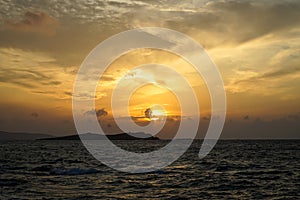 Beautiful sunset copyspace sea windy wave view with light reflection, beautiful shades of soft orange color sky and white cloud