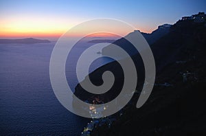 Sunset over the harbor seen from Fira, Santorini, Greece