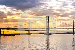 Beautiful sunset at The Forth road bridge and Queensferry crossing bridge Edinburgh