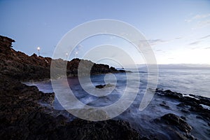 Beautiful after sunset glow at rocks at Kaanapali Beach in Maui Hawaii