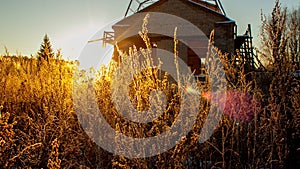 Beautiful sunset through the grass. In the winter sky