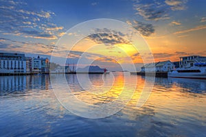 Beautiful sunset in the harbor of Alesund town, Norway