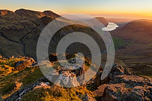 Beautiful Sunset High Up In Mountains With Wastwater Lake In Distance, Lake District, UK.