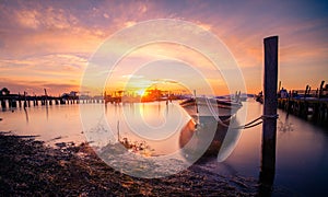 Beautiful sunset landscape with boats at the lagoon of Mesolongi,