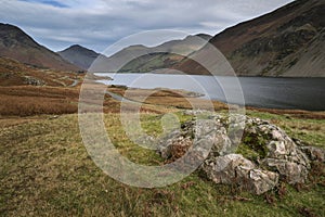 Beautiful sunset landscape image of Wast Water and mountains in