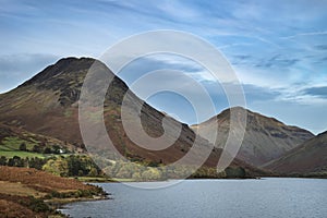 Beautiful sunset landscape image of Wast Water and mountains in