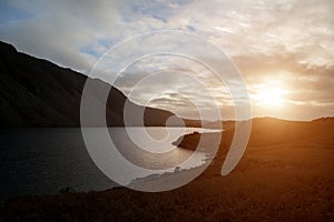 Beautiful sunset landscape image of Wast Water and mountains in