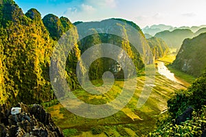 Beautiful sunset landscape viewpoint from the top of Mua Cave mountain, Ninh Binh, Tam Coc, Vietnam photo