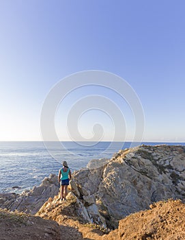 beautiful sunset, latin woman, panoramic view, comet point, huatulco Mexico