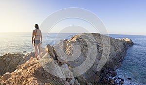 beautiful sunset, latin woman, panoramic view, comet point, huatulco Mexico