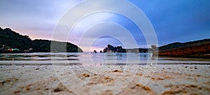 Beautiful sunset at Loh Dalum Beach in Phi Phi Islands in Thailand. Boats and ferries making their way to the shores. selective