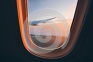 Beautiful sunset look through airplane window