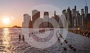 Beautiful Sunset and Lower Manhattan skyline with East River and New York City. Twilight with Reflections