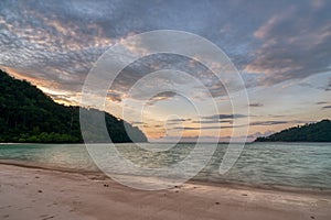 Beautiful sunset at Mai ngam beach in Koh Surin national park, the famous free driving spot in Pang Nga, Thailand