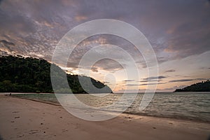 Beautiful sunset at Mai ngam beach in Koh Surin national park, the famous free driving spot in Pang Nga, Thailand