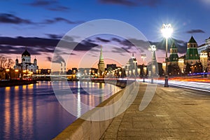 Beautiful sunset on Moskva river embankment with a view of Kremlin wall and Cathedral of Christ the Saviour in Moscow