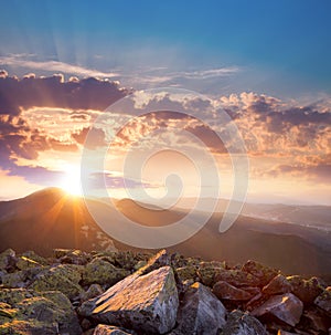 Beautiful sunset in the mountains landscape. Dramatic sky and co