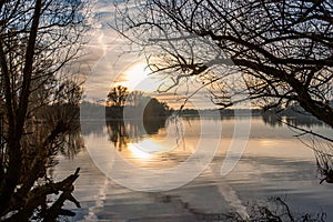 Beautiful sunset with orange and yellow gold colors in winter time