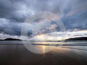 Beautiful sunset over the calm sea with cloud and sky background. Sunset over tropical beach. Nature summer  concept. Peak sunset