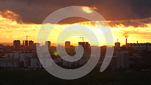 Beautiful sunset over city, close up on modern downtown Novosibirsk skyline buildings