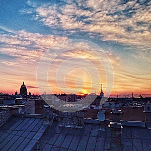 Beautiful sunset over city roofs