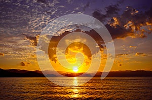 Beautiful sunset over the dam at Kaeng Krachan national park, Phetchaburi province, Thailand