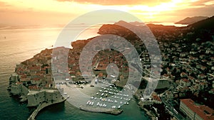 Beautiful sunset over Dubrovnik Old Town and marina, Croatia. Aerial view