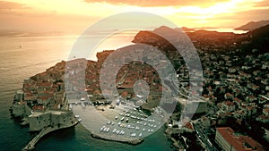 Beautiful sunset over Dubrovnik Old Town and marina, Croatia. Aerial view