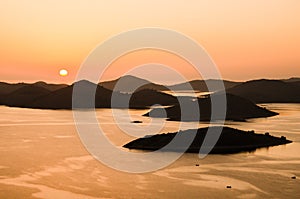 Beautiful sunset over the famous Kornati national park in Croatia, Europe, view from the top of the Zut island