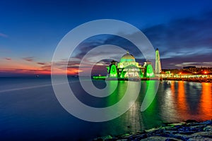 Beautiful sunset over the majestic mosque, Malacca Straits Mosque (Masjid Selat). Soft focus due to slow shutter shot.