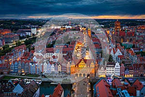 Beautiful sunset over the old town of Gdansk with City Hall and St. Mary Basilica, Poland