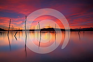 Beautiful sunset over a peacefull lake photo