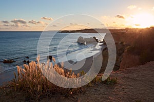 Beautiful sunset over the Praia dos Careanos and Alvor. Algarve, Portugal