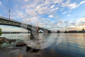 Beautiful sunset over Rhine / Rhein river and old bridge in Main