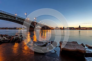 Beautiful sunset over Rhine / Rhein river and old bridge in Main