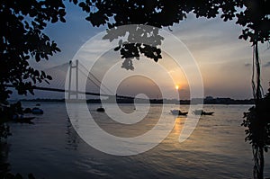 Beautiful sunset over the river scene at the Judges ghat in Kolkata