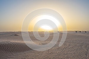 Beautiful sunset over Sahara desert in Douz, Tunisia. Sand and dunes against sky