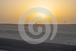 Beautiful sunset over Sahara desert in Douz, Tunisia. Sand and dunes against sky