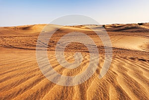Beautiful sunset over the sand dunes in the Arabian Empty Quarter Desert, UAE. Rub\' al Khali near Dubai