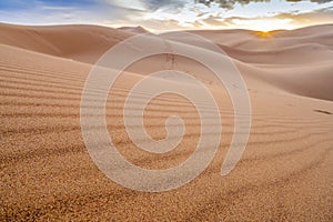 Beautiful sunset over sand dunes of Sahara Desert, Africa