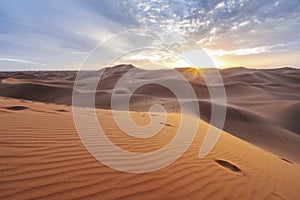 Beautiful sunset over sand dunes of Sahara Desert, Africa