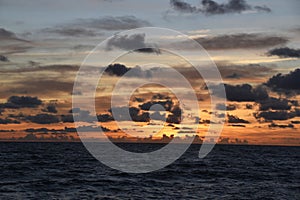 Beautiful sunset over the sea with a dramatic sky and clouds