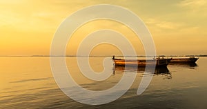 Beautiful Sunset over The Sea with Two Big Boats Floating