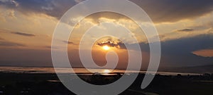 beautiful sunset over the swamp, with the dancing of the clouds surrounding it