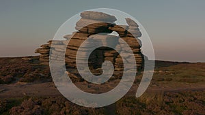 Beautiful sunset over the Wheel Stones found near Derwent Edge in the Peak District National Park, Derbyshire, UK